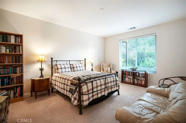 a swimming pool with outdoor seating and yard