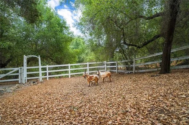 an aerial view of a house with yard swimming pool and outdoor seating