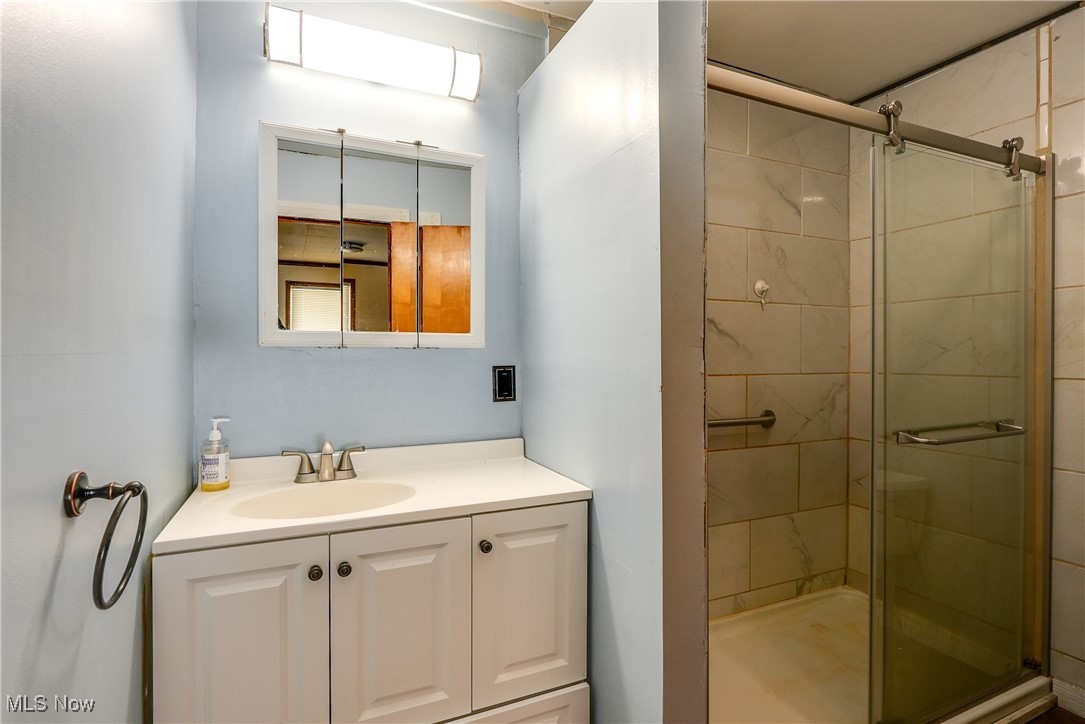 5865 Beach Road Wadsworth, OH 44281 - Photo 9 of 33 Bathroom with walk in shower and vanity