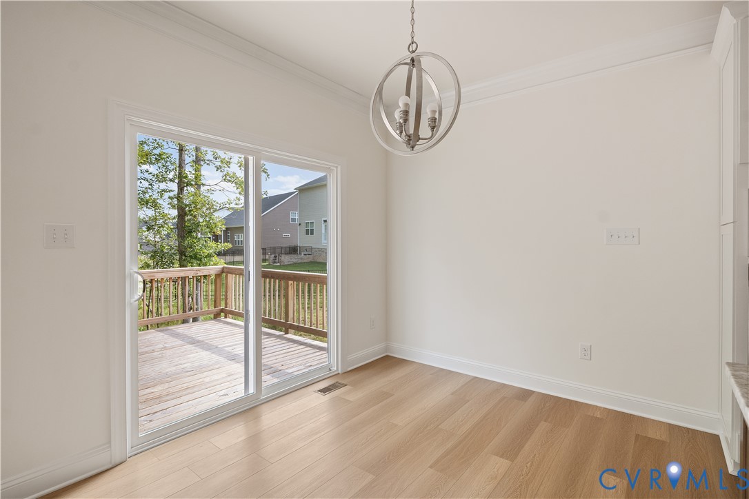 4648 McGhee House Road Mechanicsville, VA 23111 - Photo 13 of 39 an empty room with wooden floor and windows