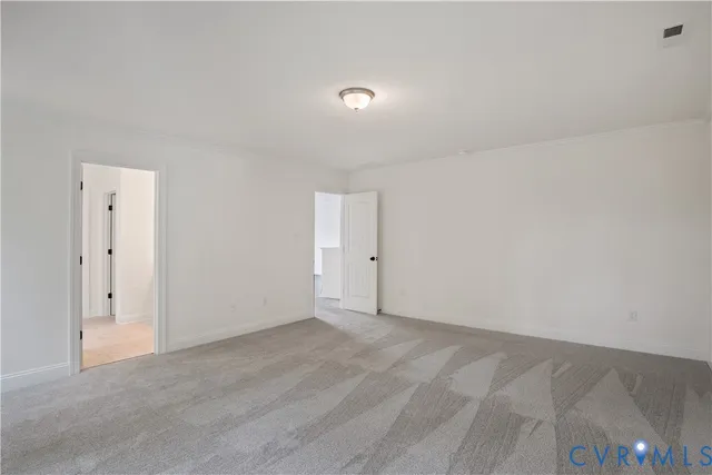 a bedroom with bed and a large window