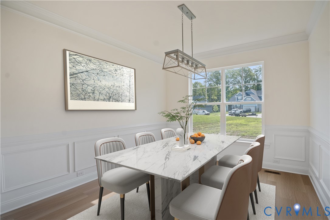 4648 McGhee House Road Mechanicsville, VA 23111 - Photo 4 of 39 a view of a dining room with furniture window and wooden floor