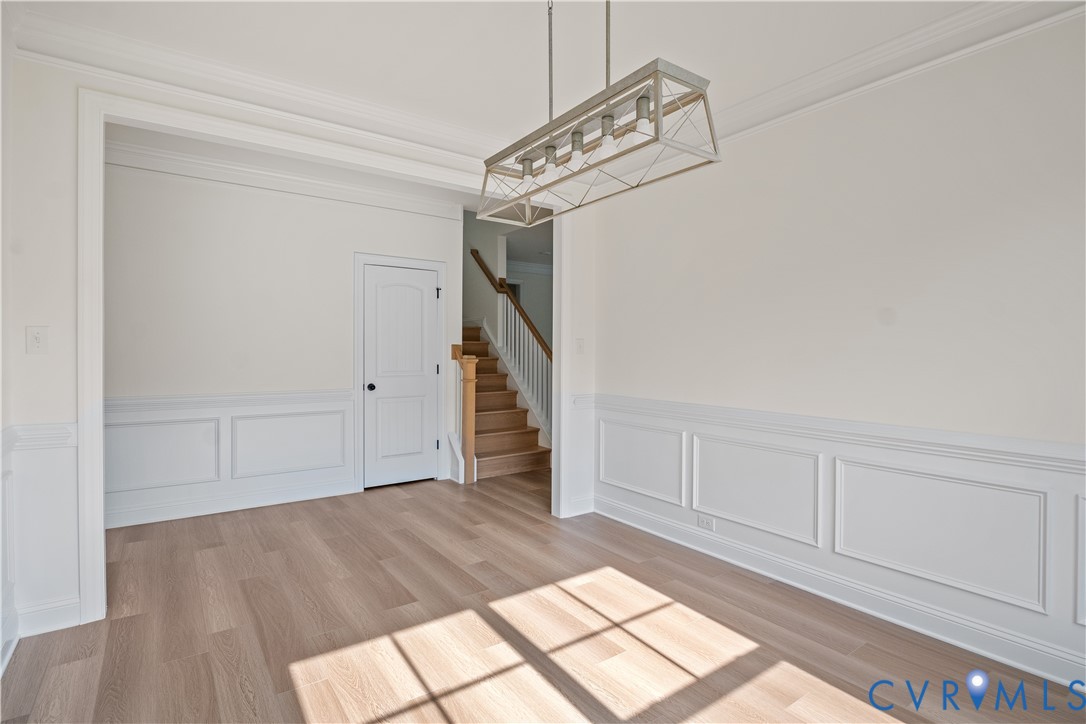 4648 McGhee House Road Mechanicsville, VA 23111 - Photo 6 of 39 a view of empty room with wooden floor and fan
