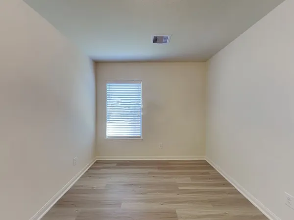 a view of an empty room and window