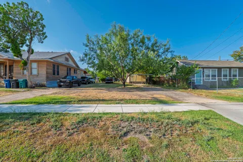 a swimming pool view with a outdoor seating