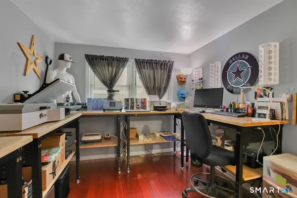 a room with furniture and a wooden floor