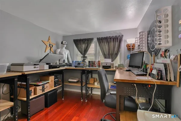 a view of a workspace with furniture and toys
