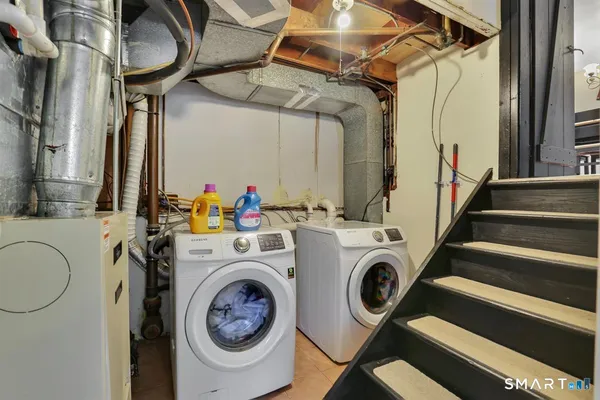 a utility room with dryer and washer