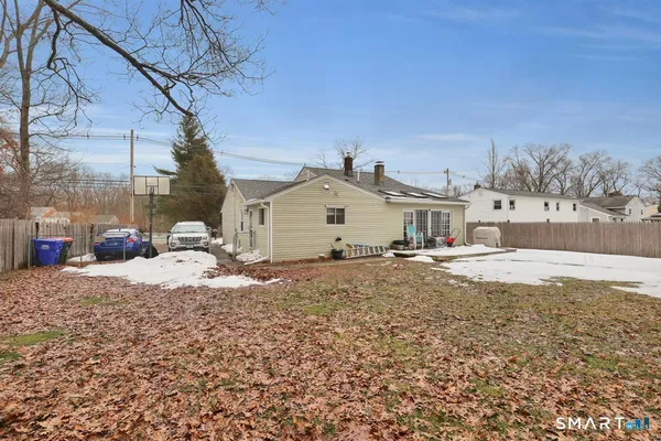 a view of a house with a snow on the road