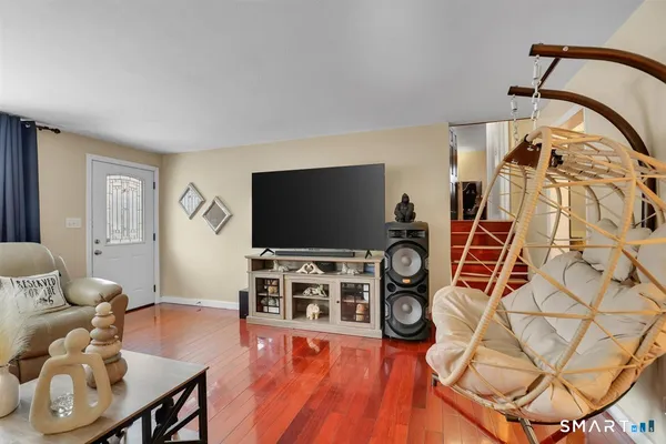 a living room with furniture and a flat screen tv