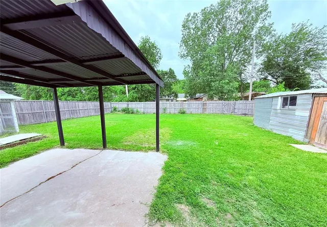 a view of a deck with a big yard
