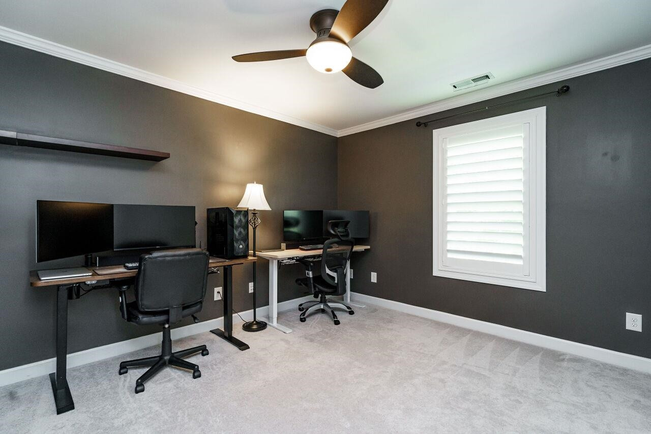 3003 Red Grape Drive Raleigh, NC 27607 - Photo 28 of 35 Home office/gym/bedroom with ceiling fan, shutters, great closet! Secondary Bedroom