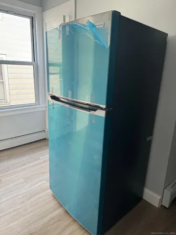 a kitchen with a sink cabinets and stainless steel appliances