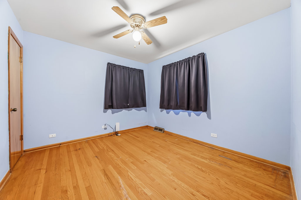 22 Charing Cross Road Chicago Heights, IL 60411 - Photo 19 of 25 a view of a room with wooden floor and cabinet