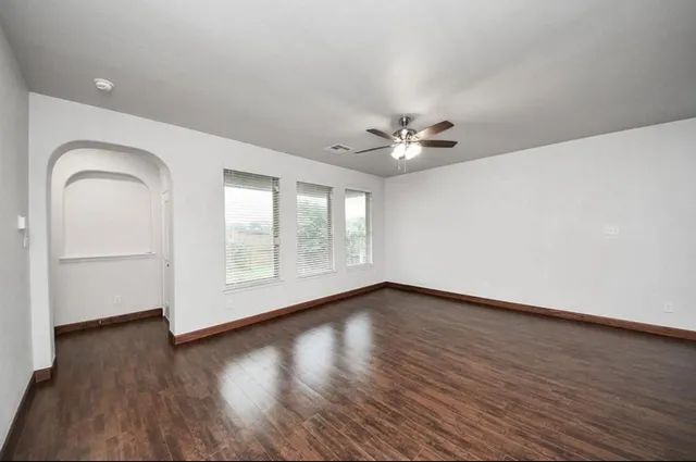 a bathroom with a shower and a glass door