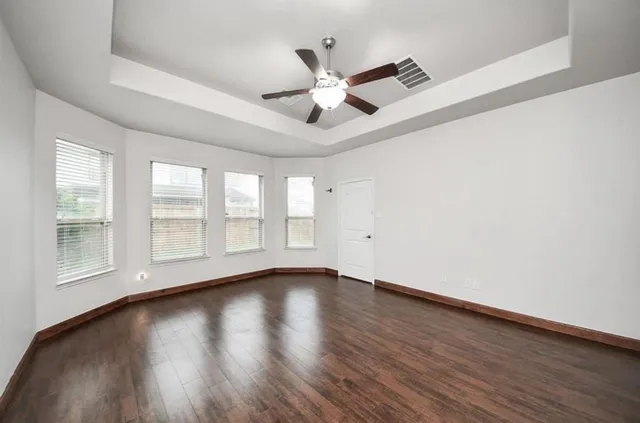 a bathroom with a shower and a glass door