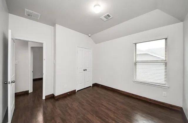 a white toilet sitting next to a white sink