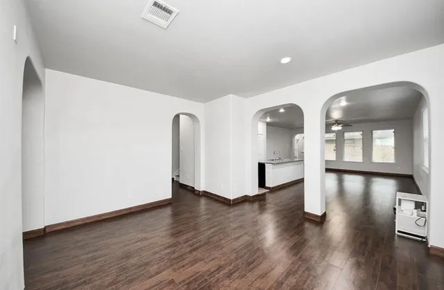 a view of an entryway with wooden floor