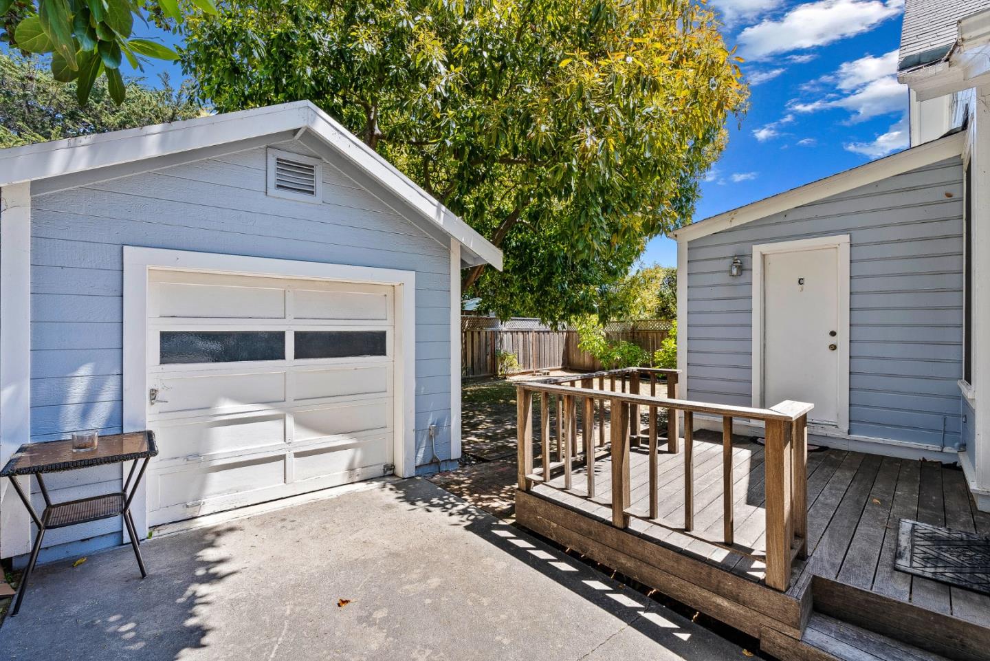 514 Washington Street Santa Cruz, CA 95060 - Photo 5 of 25 a view of a deck with a wooden fence and a floor to ceiling window