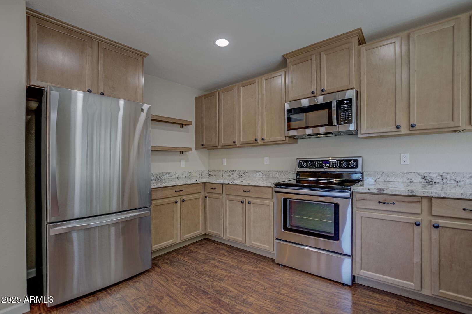 938 West Madera Lane Payson, AZ 85541 - Photo 3 of 28 a kitchen with stainless steel appliances white cabinets white stove a microwave and a refrigerator