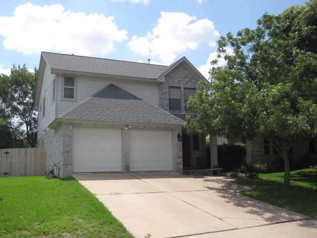 a front view of a house with garage