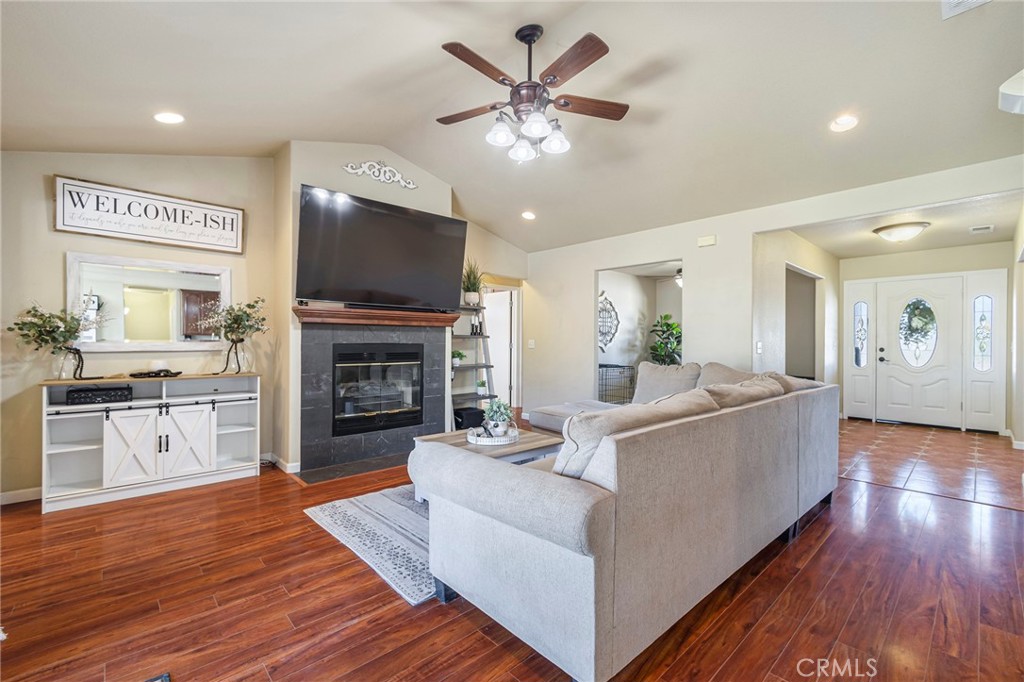 23446 Capay Road Corning, CA 96021 - Photo 11 of 64 a living room with furniture fireplace and flat screen tv