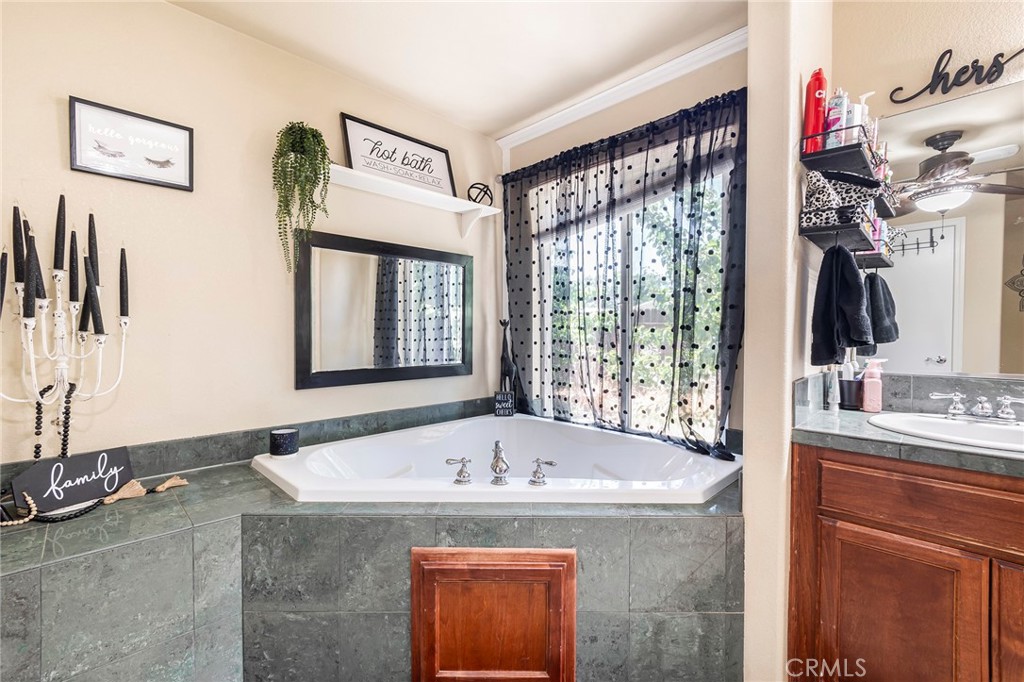 23446 Capay Road Corning, CA 96021 - Photo 23 of 64 a bath tub sitting next to a window