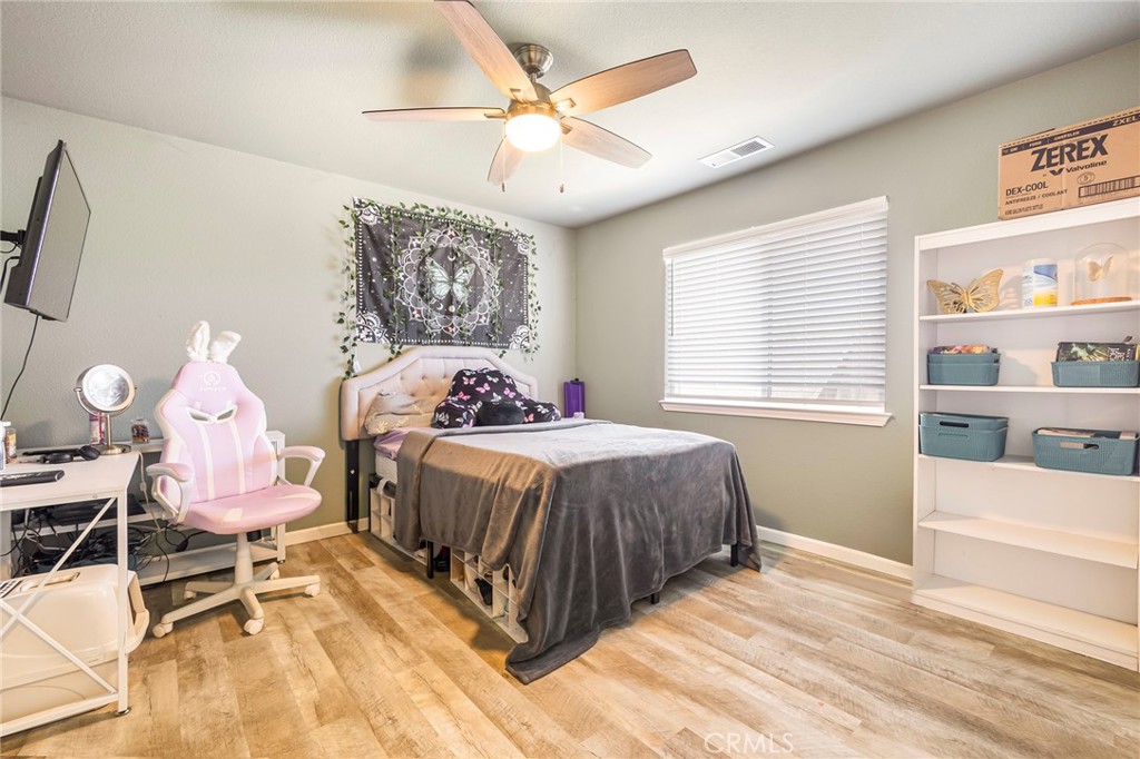 23446 Capay Road Corning, CA 96021 - Photo 29 of 64 a bedroom with a bed and a window