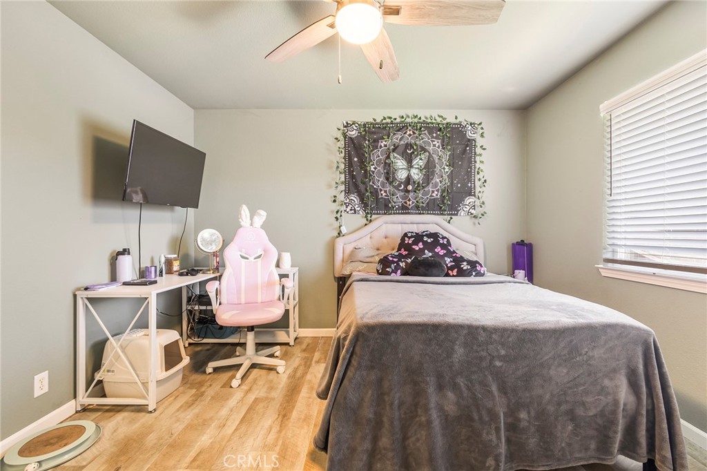 23446 Capay Road Corning, CA 96021 - Photo 30 of 64 a bedroom with a bed and flat screen tv