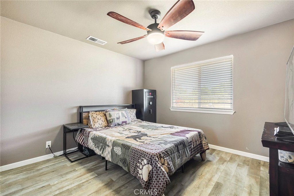 23446 Capay Road Corning, CA 96021 - Photo 31 of 64 a bedroom with a bed and a window