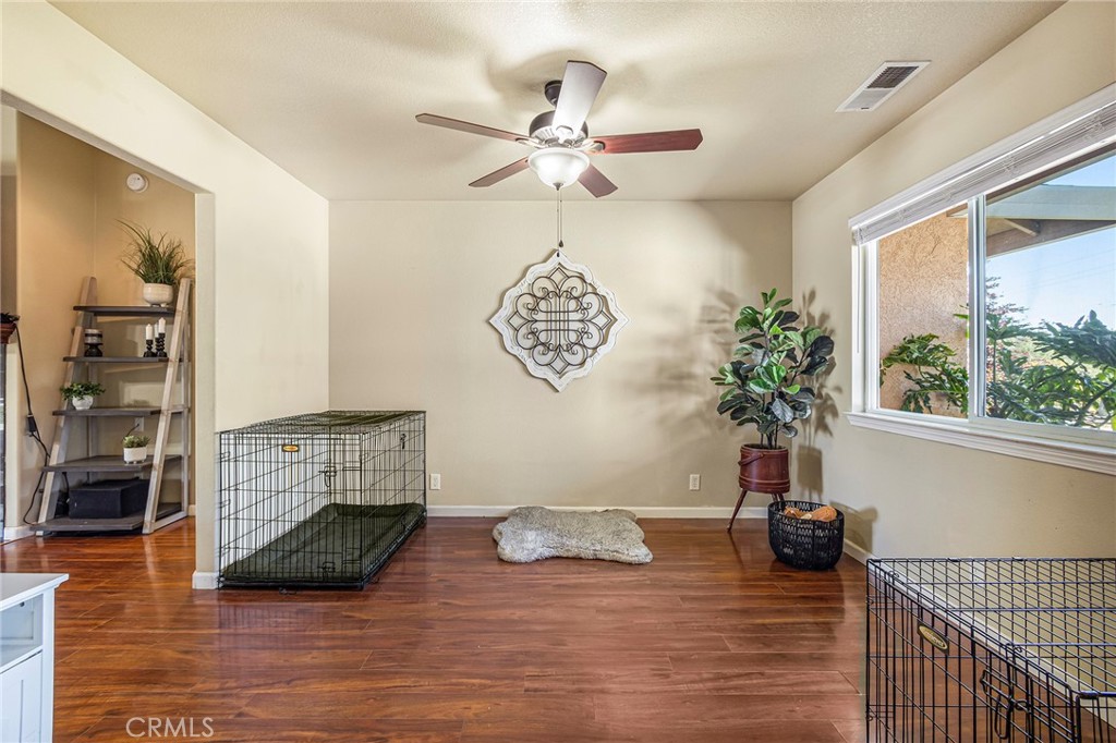 23446 Capay Road Corning, CA 96021 - Photo 33 of 64 a view of a livingroom with furniture hardwood floor and a ceiling fan