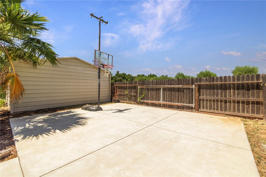 23446 Capay Road Corning, CA 96021 - Photo 43 of 64 a view of a house with a wooden fence