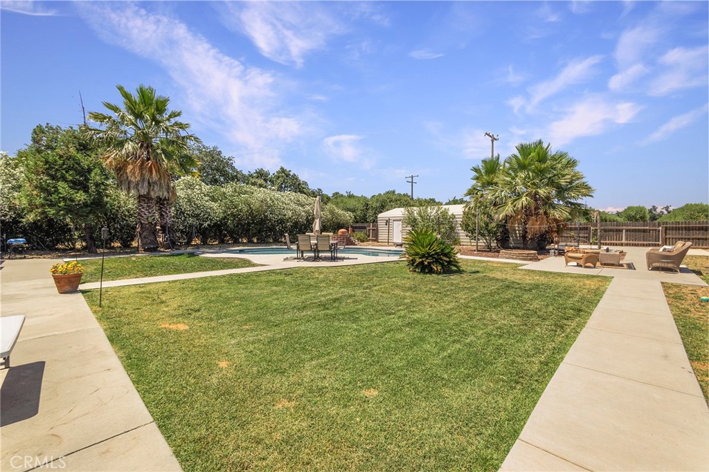23446 Capay Road Corning, CA 96021 - Photo 50 of 64 a view of a swimming pool with a yard