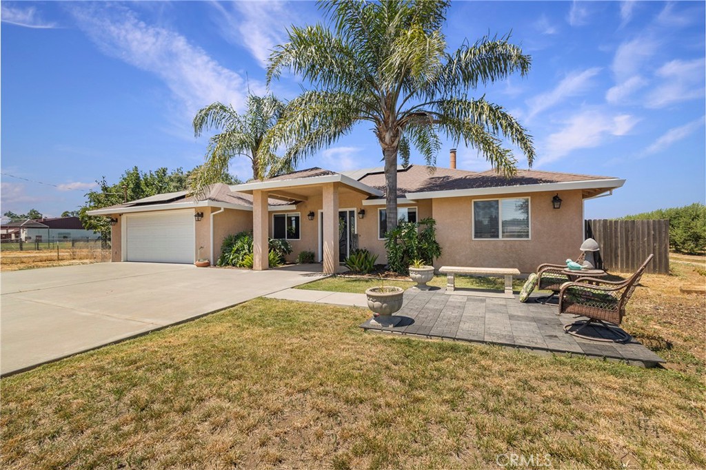 23446 Capay Road Corning, CA 96021 - Photo 7 of 64 a view of a house with backyard and sitting area