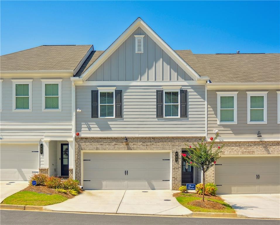 a view of a house with a yard and plants