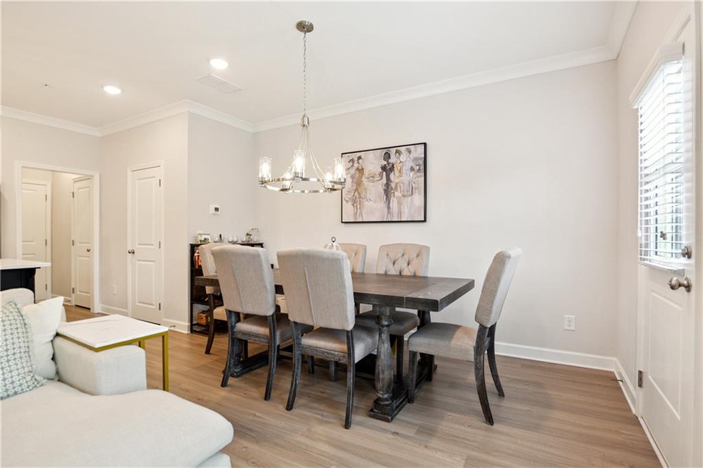 765 Trevett Way Marietta, GA 30066 - Photo 12 of 46 a view of a dining room with furniture and wooden floor