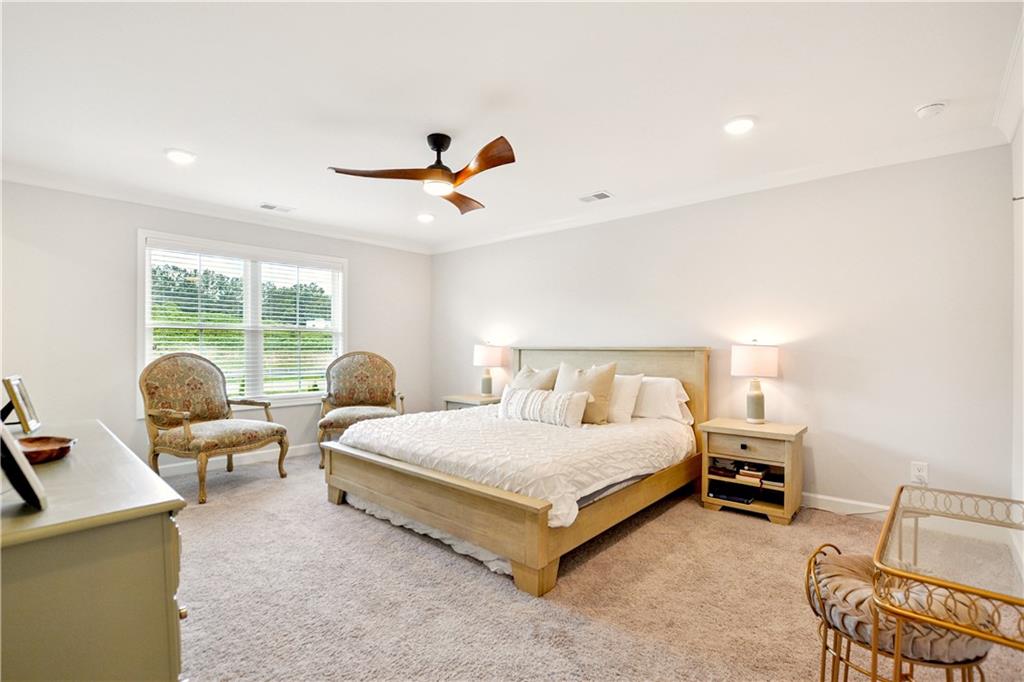 765 Trevett Way Marietta, GA 30066 - Photo 20 of 46 a bedroom with a bed and a chandelier