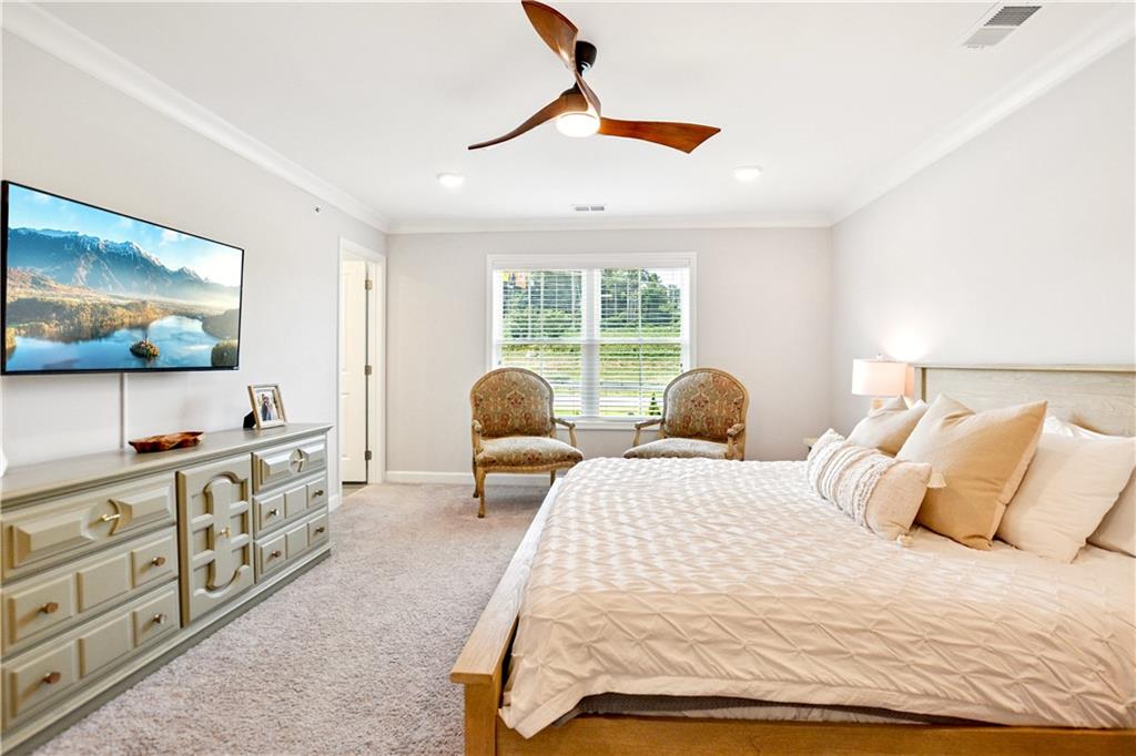 765 Trevett Way Marietta, GA 30066 - Photo 21 of 46 a bedroom with a bed and a flat screen tv