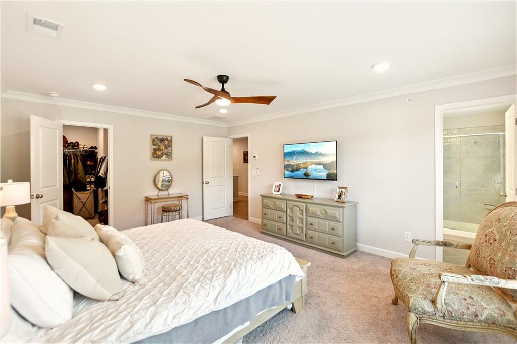 765 Trevett Way Marietta, GA 30066 - Photo 24 of 46 a bedroom with a bed and a dresser