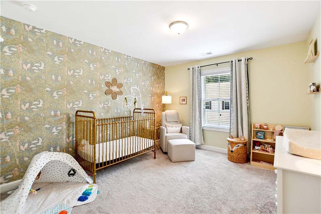 765 Trevett Way Marietta, GA 30066 - Photo 28 of 46 a bedroom with furniture and a couch