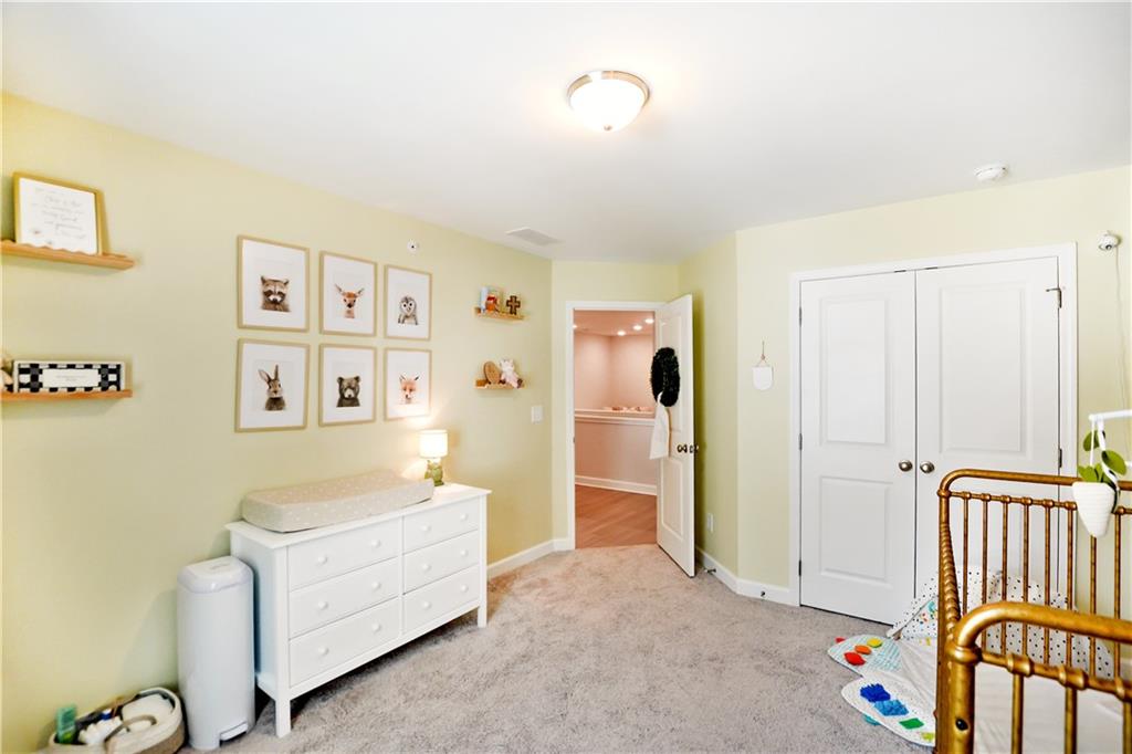 765 Trevett Way Marietta, GA 30066 - Photo 29 of 46 a living room with furniture and baby crib