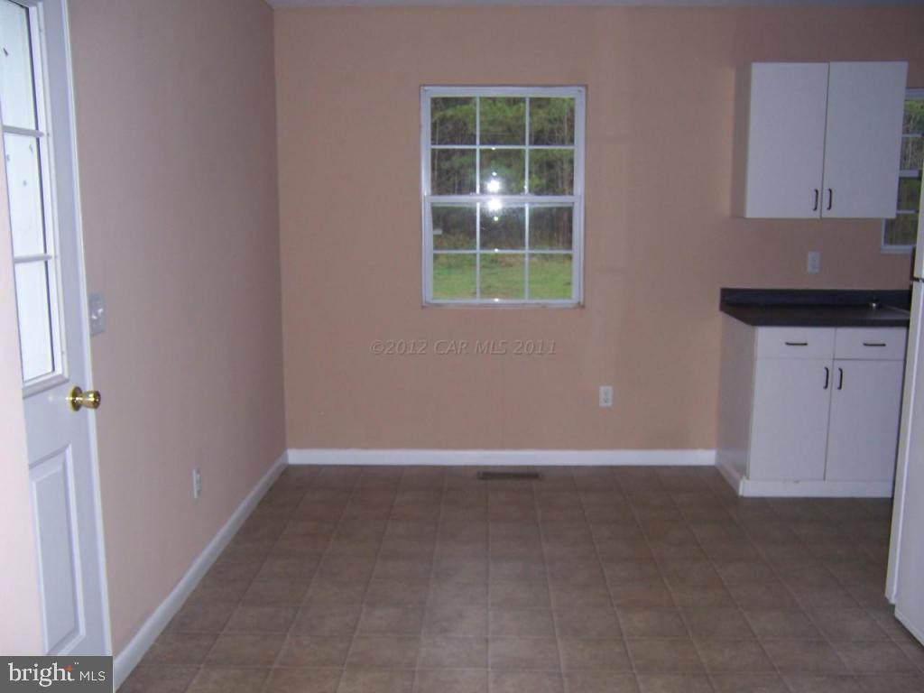 6172 Quantico Road Quantico, MD 21856 - Photo 3 of 8 a view of an empty room with a window