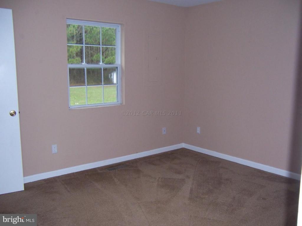 6172 Quantico Road Quantico, MD 21856 - Photo 5 of 8 an empty room with a window