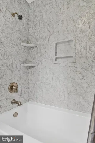 a bathroom with a bathtub