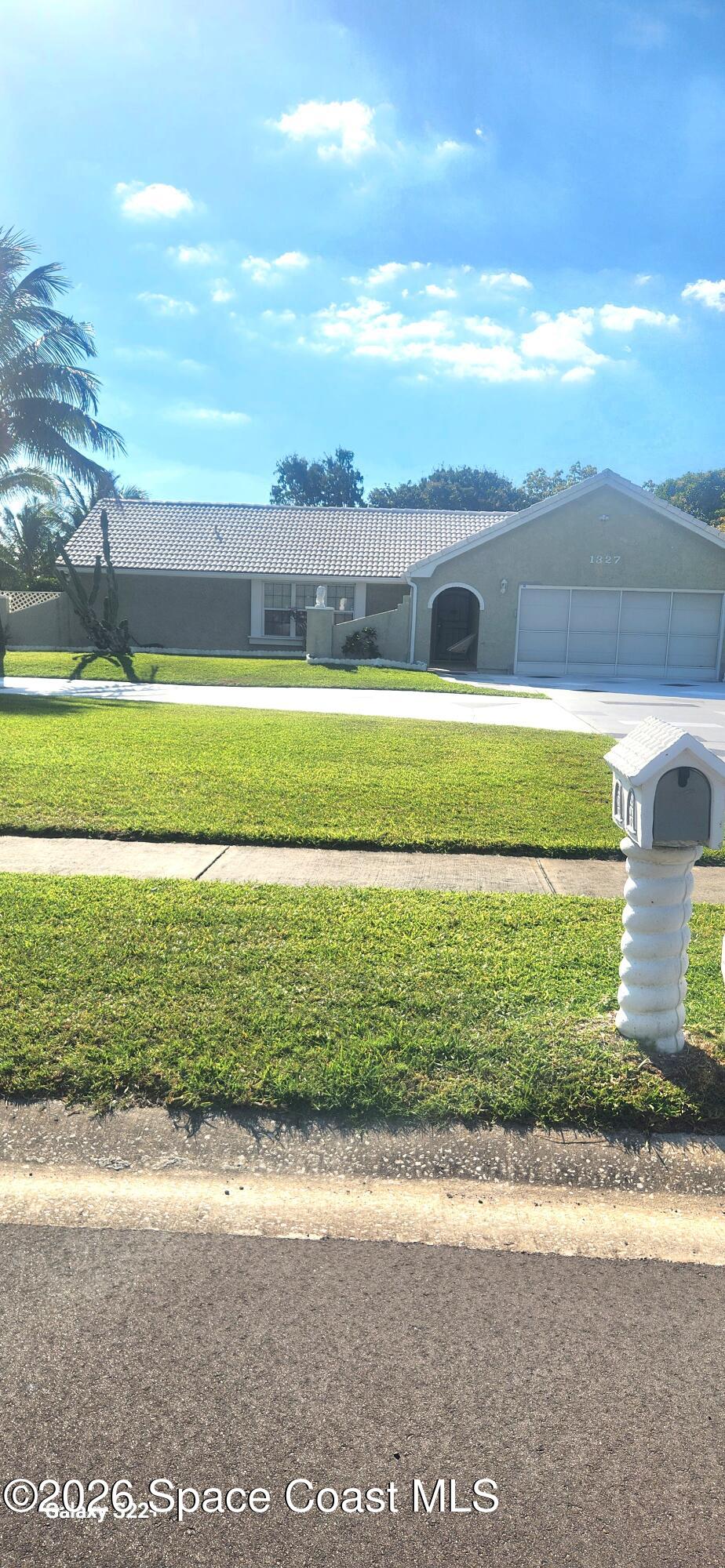 1327 Cherry Hills Road Northeast Palm Bay, FL 32905 - Photo 1 of 20 1327 cherry hills front of house