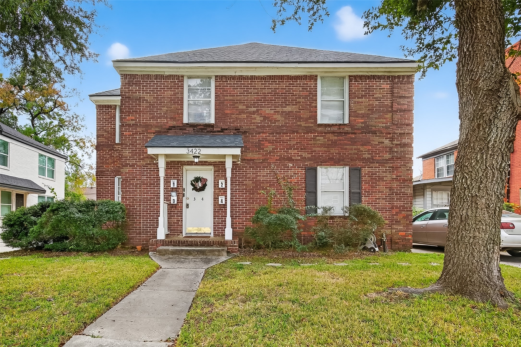 a front view of a house with garden