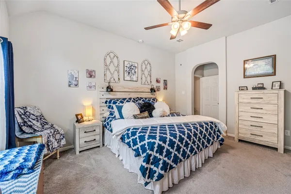 a bedroom with bed and window
