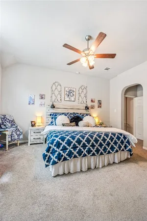 a bedroom with a bed and window
