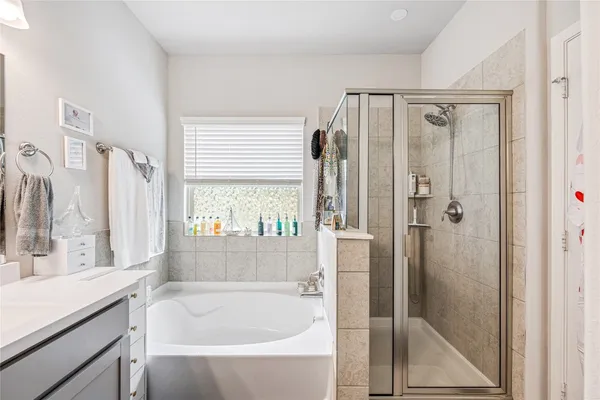 a bathroom with a bathtub and a sink