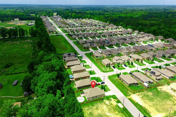 an aerial view of house with yard swimming pool and outdoor seating